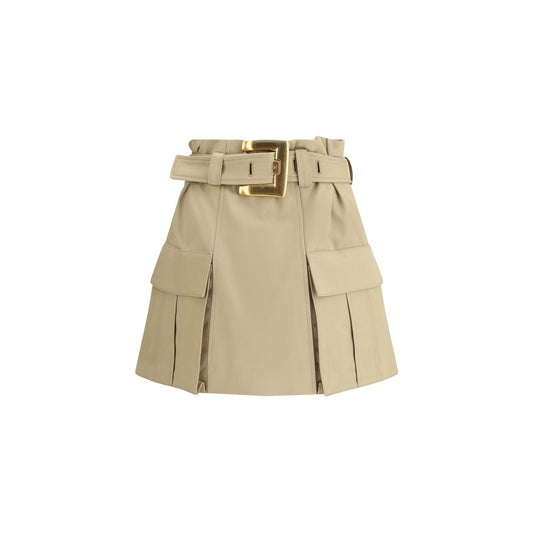 Balmain Beige Cotton Mini Skirt with gold buckle, gusseted side pockets, and iconic zipper detail, AW25 collection.