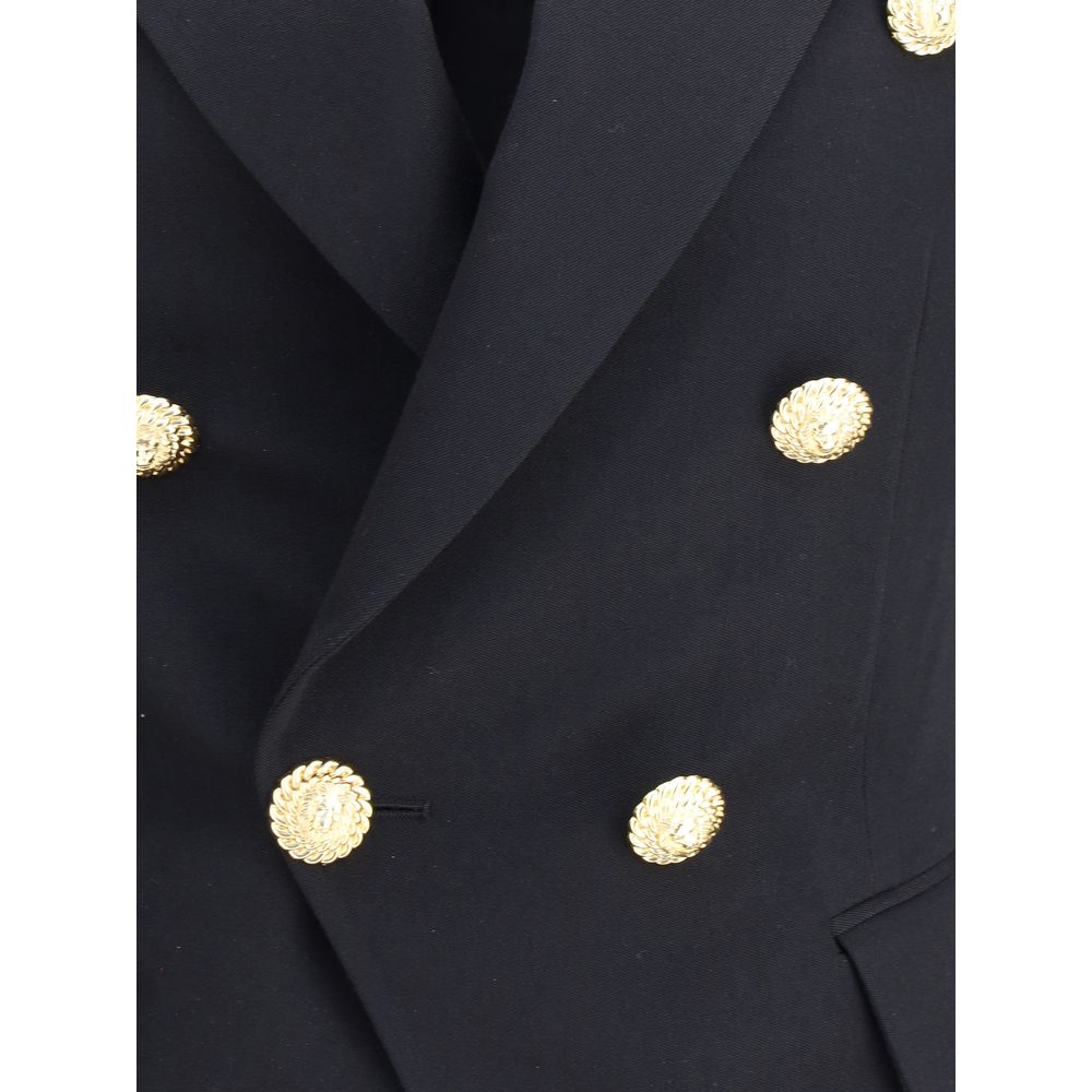 Close-up of Balmain Black Wool Blazer with embossed gold buttons, showcasing its elegant double-breasted design and peaked lapels.