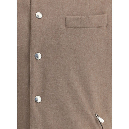 Close-up of Brunello Cucinelli Brown Wool Clothing showing snap-button detail and zippered pocket from AW25 collection.