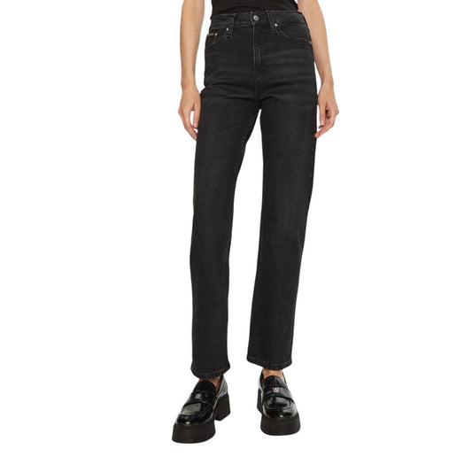 Woman wearing Calvin Klein Jeans Black Cotton Mom Jeans, high-rise straight leg design, perfect fit for stylish and modern look.