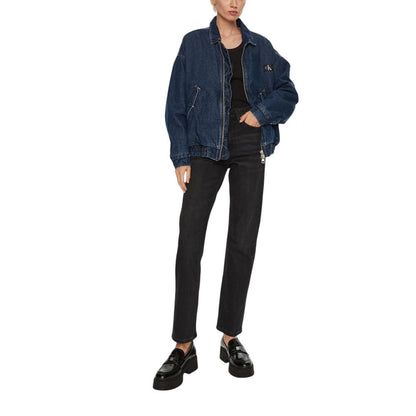 Woman wearing Calvin Klein Jeans Black Cotton Mom Jeans with denim jacket and loafers