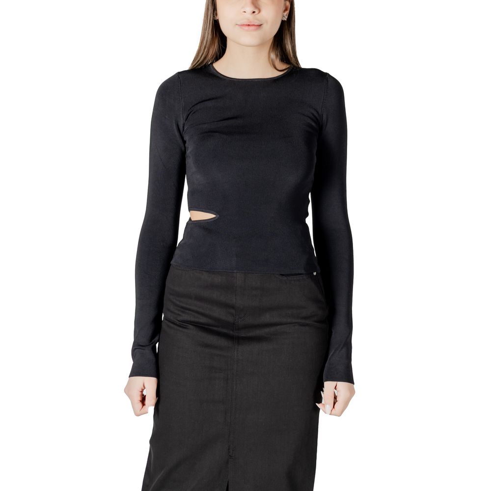 Woman wearing Calvin Klein Jeans Black Rayon Shirt with cut-out detail, long sleeves, paired with a black skirt, front view