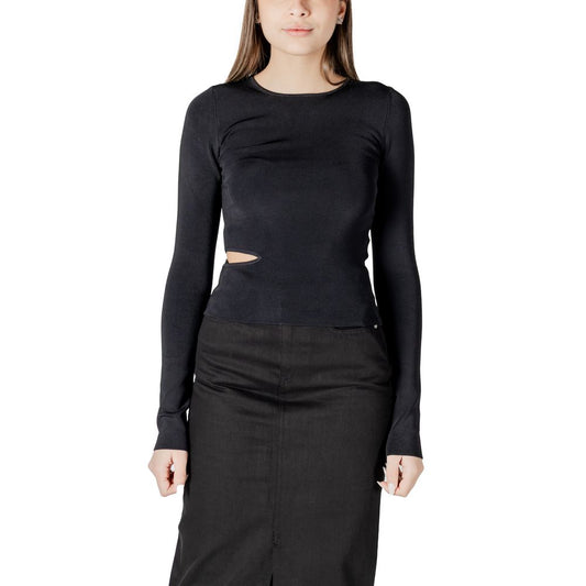 Woman wearing Calvin Klein Jeans Black Rayon Shirt with cut-out detail, long sleeves, paired with a black skirt, front view