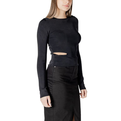 Calvin Klein Jeans Black Rayon Shirt with cut-out detail, worn by a model, showcasing stylish and comfortable design for casual and evening wear.