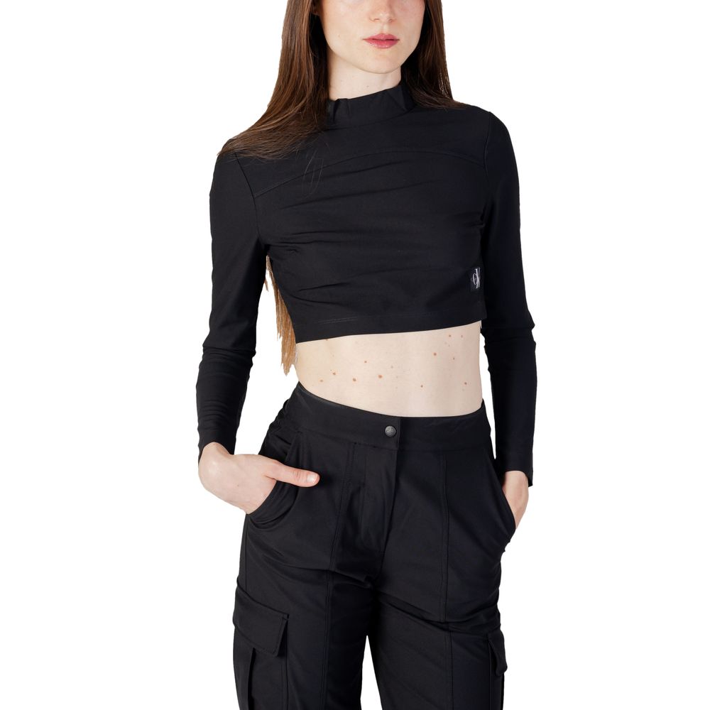 Woman wearing Calvin Klein Jeans Black Recycled Polyester Top with high collar and long sleeves, showcasing modern and versatile style.