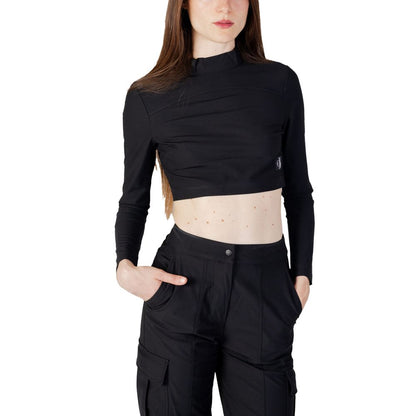 Woman wearing Calvin Klein Jeans Black Recycled Polyester Top with high collar and long sleeves, showcasing modern and versatile style.