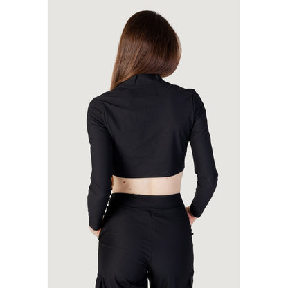 Back view of a woman wearing Calvin Klein Jeans Black Recycled Polyester Top with high collar and long sleeves.
