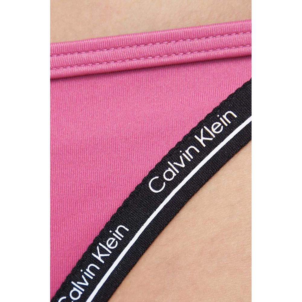 Close-up of Calvin Klein Jeans Pink Polyester Swim Briefs with branded elastic detail.