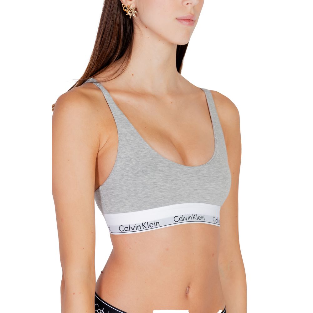 Model wearing Calvin Klein Underwear Gray Cotton Bra with branded band, showcasing minimalist and modern design for everyday comfort.