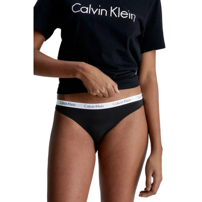 Model wearing Calvin Klein Underwear White Cotton Pantie, demonstrating sleek design and comfort. Ideal for everyday wear.