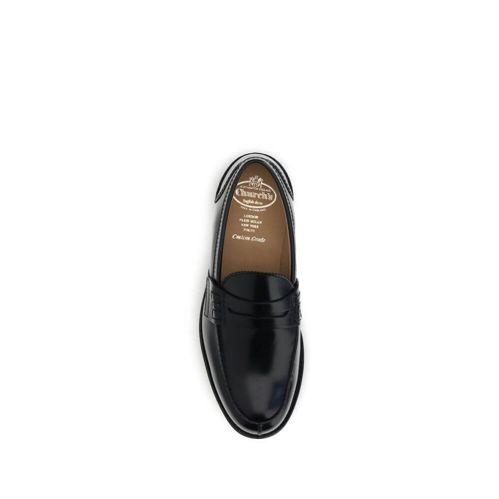 Church's Black Calf Leather Bos Taurus Slip-On Loafers with refined college style, hand-stitched sides, and folded topline.