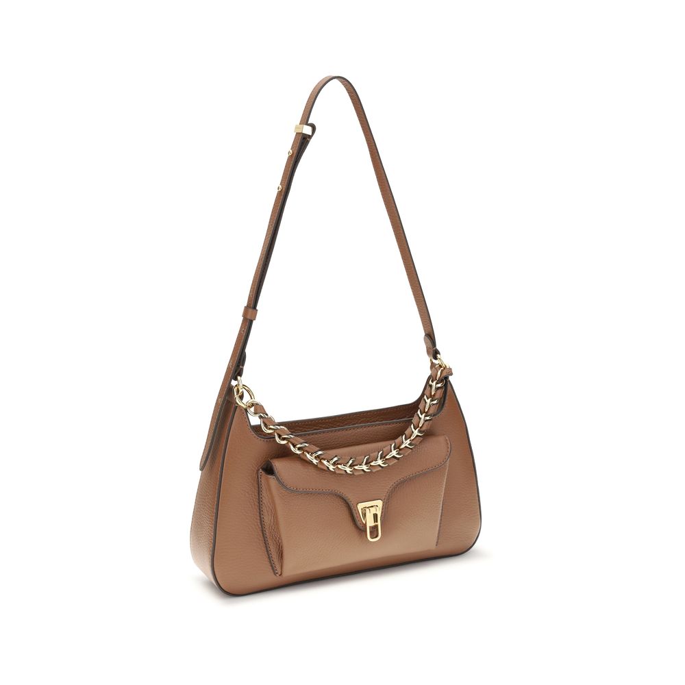 Coccinelle Beige Calf Leather Bos Taurus Shoulder Bag with gold chain handle and adjustable strap.