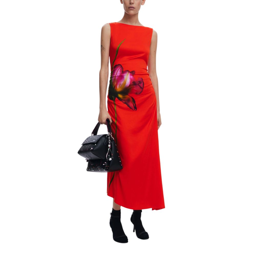Woman wearing Desigual Red Viscose Long Dress with floral design and holding a black handbag.