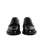 Dolce & Gabbana Black Calf Leather Lace Up Dress Shoes with logo details, made in Italy, featuring elegant craftsmanship.