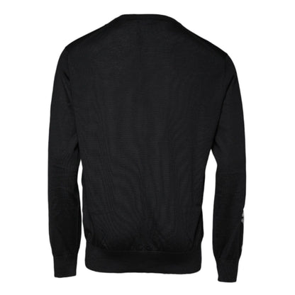 Dolce & Gabbana Black Cashmere Crew Neck Pullover Sweater, rear view of the luxurious Italian-made sweater with a repaired hole on sleeve.