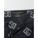Close-up of Dolce & Gabbana Black DG Monogram Cotton Skinny Denim Jeans, showcasing the iconic DG branding for a luxury fashion statement.