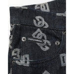 Close-up of Dolce & Gabbana Black DG Monogram Cotton Skinny Denim Jeans with logo detail on pocket and luxury branding design.