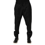 Dolce & Gabbana Black Drawstring Men Jogger Sweatpants Pants with side pockets and ribbed cuffs, perfect for casual or streetwear style.