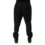 Rear view of Dolce & Gabbana Black Drawstring Men Jogger Sweatpants Pants with ribbed cuffs and adjustable waistband, perfect for streetwear.
