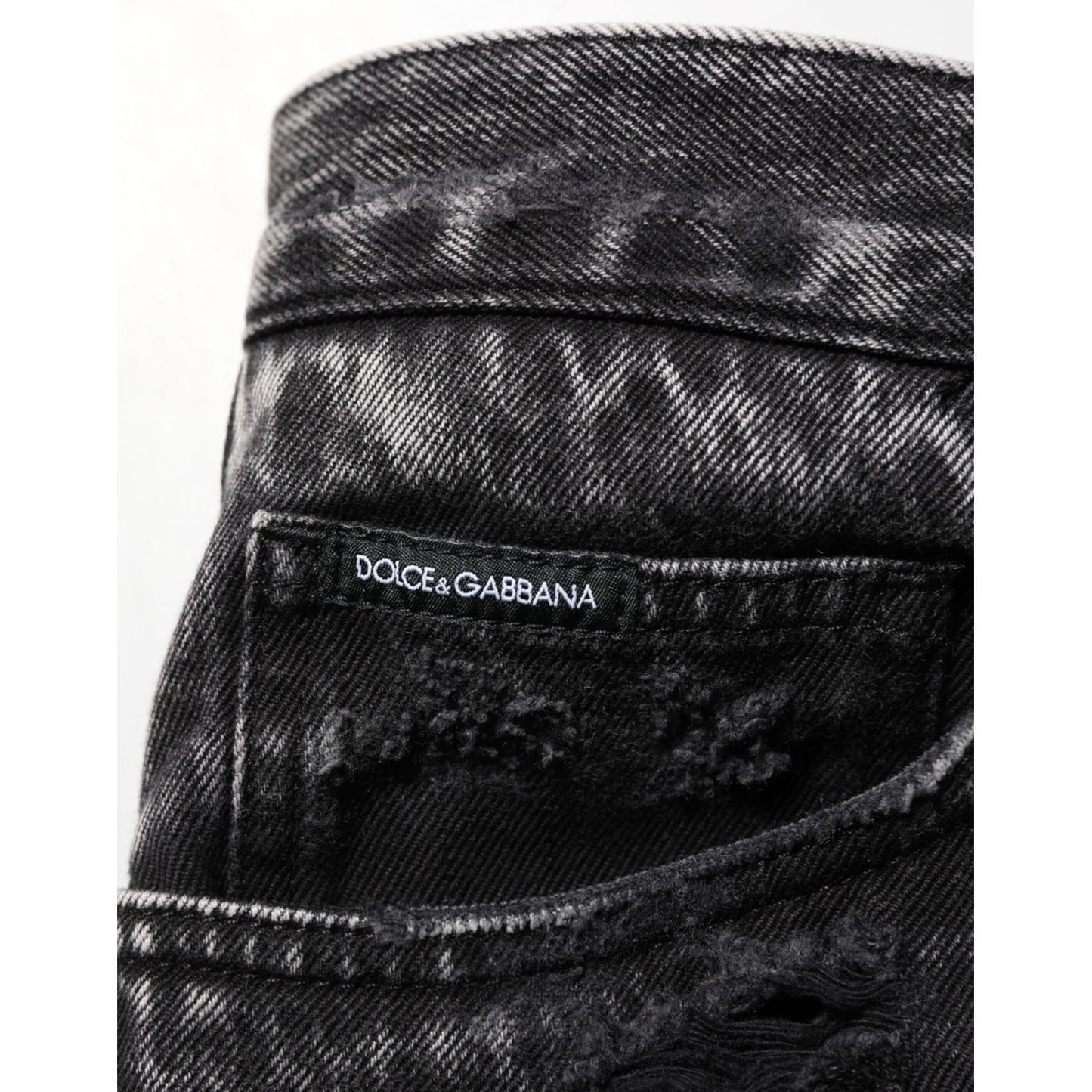 Dolce & Gabbana Black Washed Ripped Loose Cotton Denim Jeans with distressed details and relaxed fit.