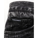 Dolce & Gabbana Black Washed Ripped Loose Cotton Denim Jeans with distressed details and relaxed fit.