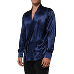 Dolce & Gabbana Blue Oversize Silk Satin Long Sleeves Shirt featuring a luxurious blue color and relaxed fit, perfect for elegant styling.