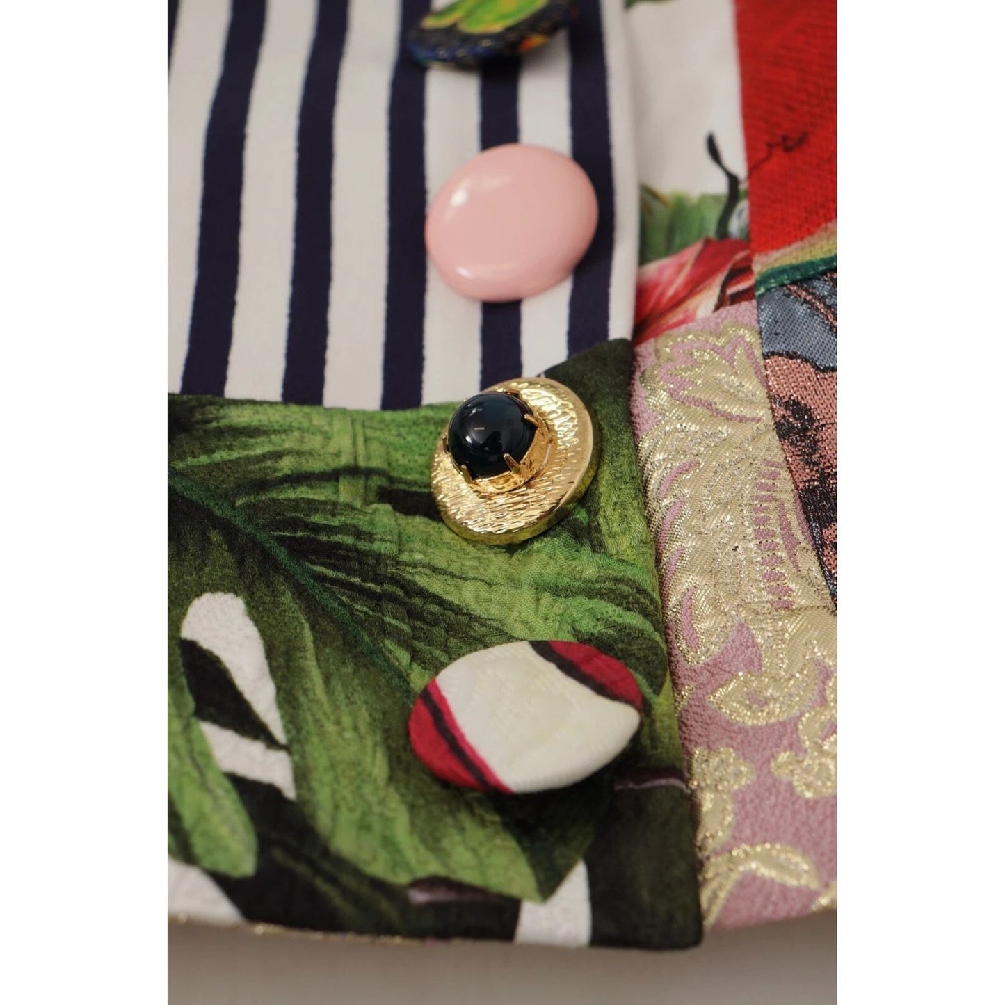 Close-up of Dolce & Gabbana Multicolor Patchwork A-line Polyester Skirt with button details and floral patterns.