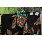 Close-up of Dolce & Gabbana Multicolor Patchwork A-line Polyester Skirt fabric and embellishments.