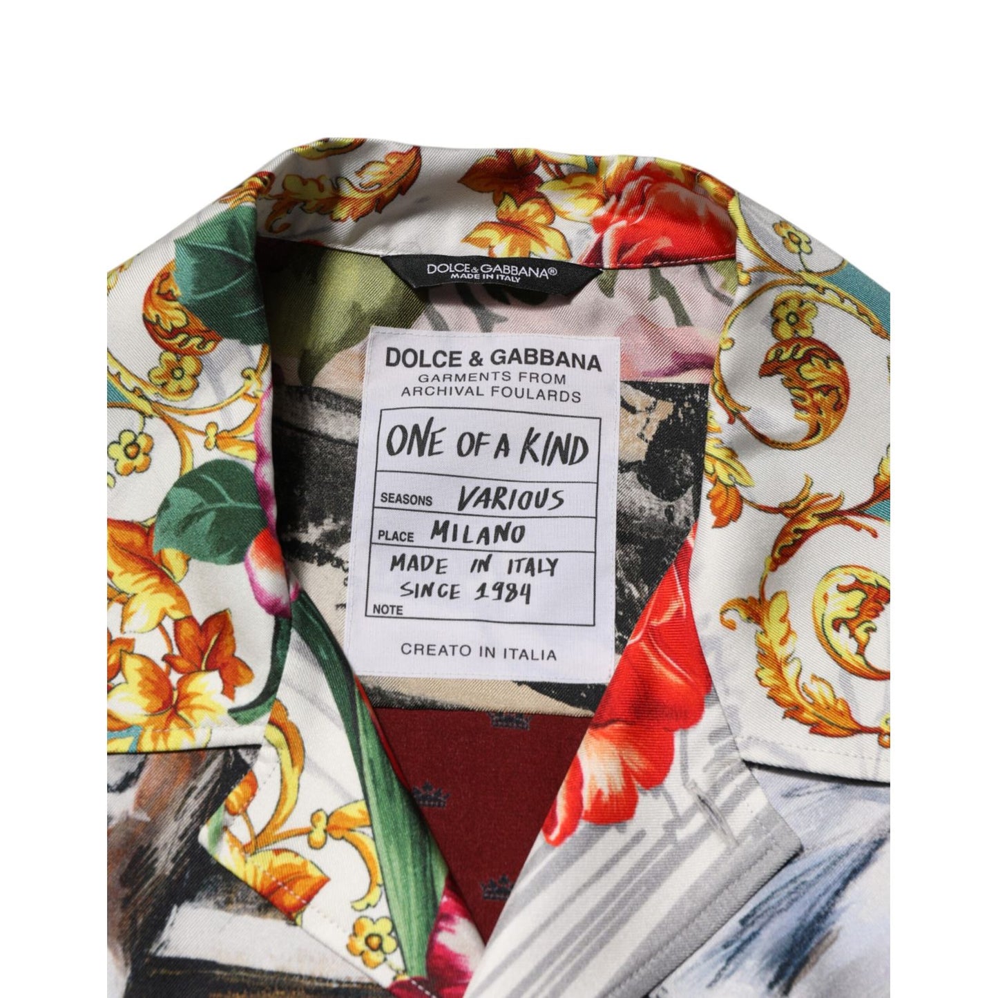 Close-up of Dolce & Gabbana Multicolor Shell Print Hawaii Casual Shirt collar with brand label and vibrant floral pattern