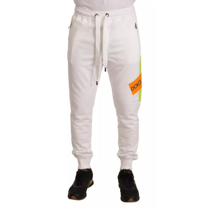 Dolce & Gabbana White Cotton Logo Patch Sweatpants Jogging Pants with drawstring and pockets, model wearing black shoes and white shoes