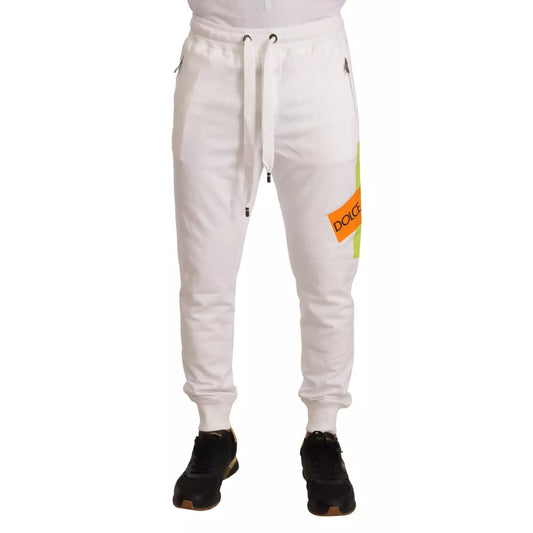 Dolce & Gabbana White Cotton Logo Patch Sweatpants Jogging Pants with drawstring and pockets, model wearing black shoes and white shoes