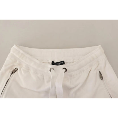 Dolce & Gabbana White Cotton Logo Patch Sweatpants Jogging Pants featuring drawstring closure and zipper pockets, made in Italy.