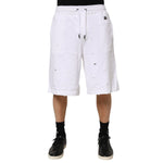 Dolce & Gabbana White Ripped Mid Waist Casual Bermuda Short on model, showcasing trendy ripped details, ideal for summer fashion.