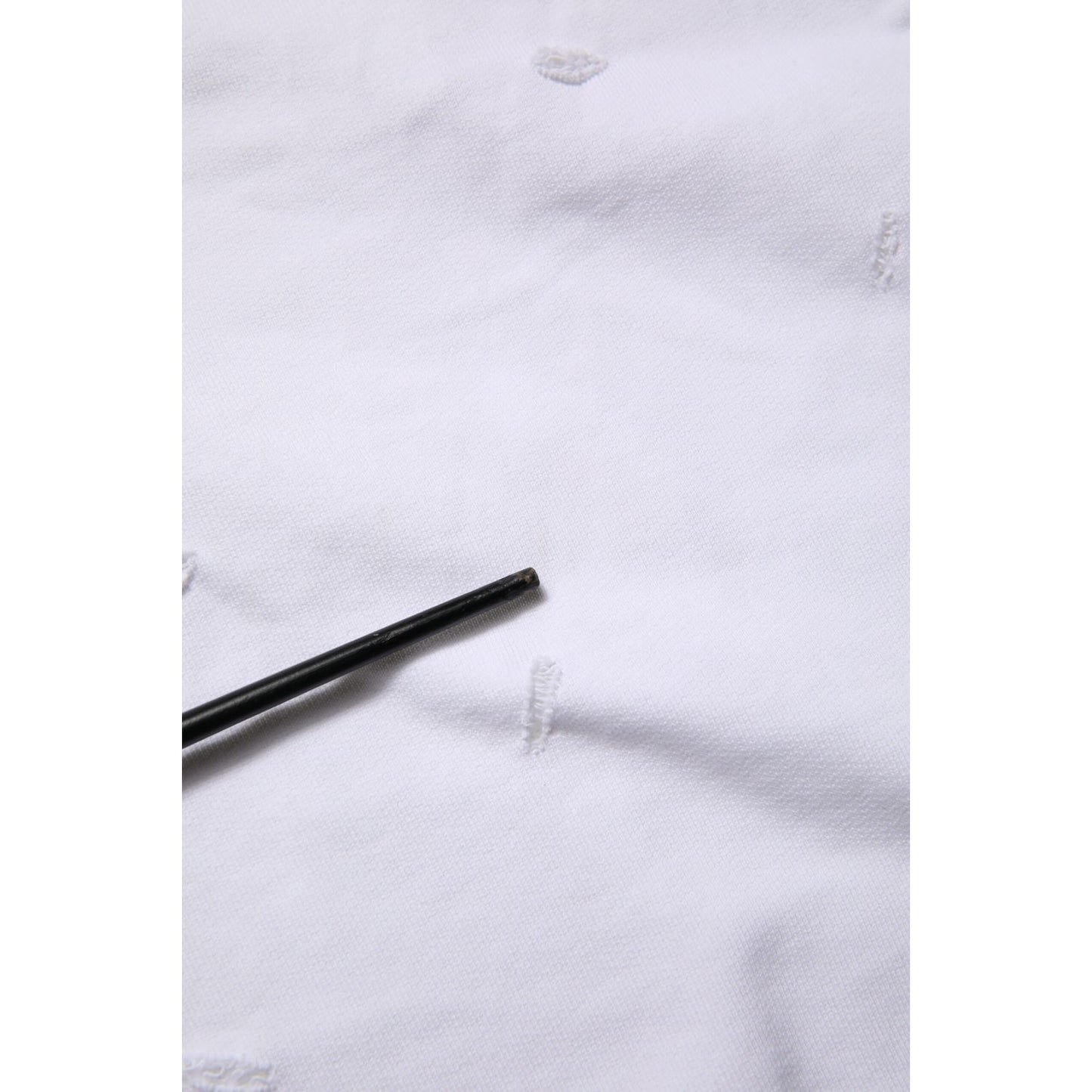 Close-up of Dolce & Gabbana White Ripped Mid Waist Casual Bermuda Short showing ripped details and fabric texture.