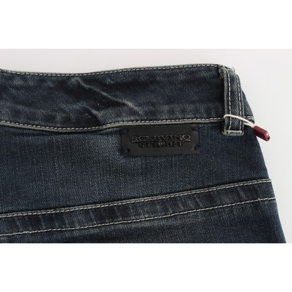 Ermanno Scervino Blue Cotton Blend Slim Fit Jeans detail with black logo patch, showcasing authentic Italian craftsmanship and quality stitching.