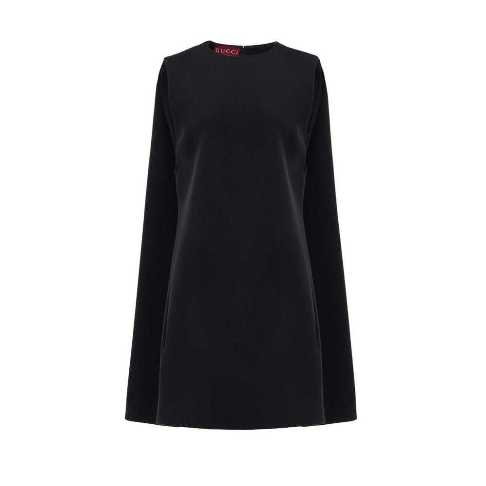Gucci Black Wool Dress, short sleeveless bell shape, two side welt pockets, hidden back zip, 60s-inspired design with pleat stitching.