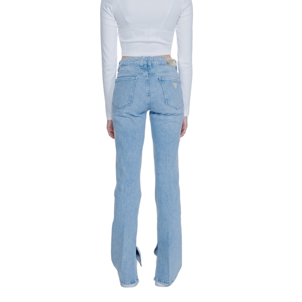 Back view of Guess Light Blue Cotton Mom Jeans with flare and split hem, highlighting the design and fit on a model wearing a white top.