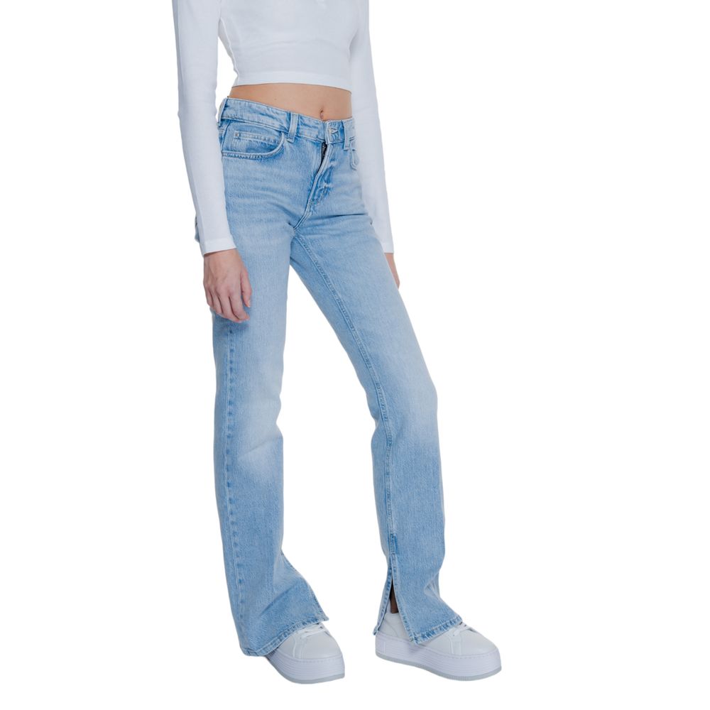 Model wearing Guess Light Blue Cotton Mom Jeans with flared split hem and five-pocket design for a modern and comfortable look.