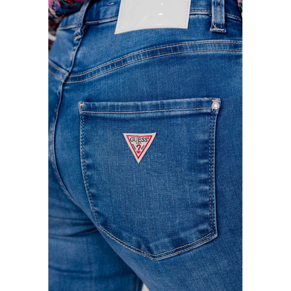 Close-up of Guess Light Blue Organic Cotton Mom Jeans back pocket with brand logo emblem.