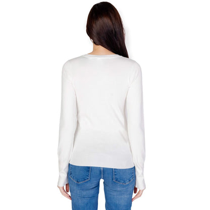 Back view of Guess White Cotton Sweatshirt with long sleeves and decorative buttons, paired with blue jeans for a casual look.