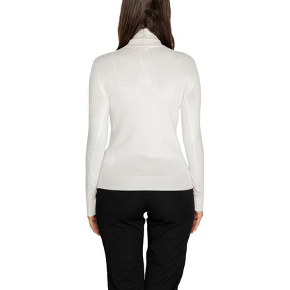 Back view of Guess White Viscose Turtleneck sweater with long sleeves and high neck, combining style and comfort for women.