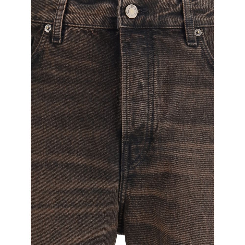 Close-up of Haikure Brown Cotton Relaxed Fit Jeans showcasing button closure and classic design with adjustable side straps for versatility.