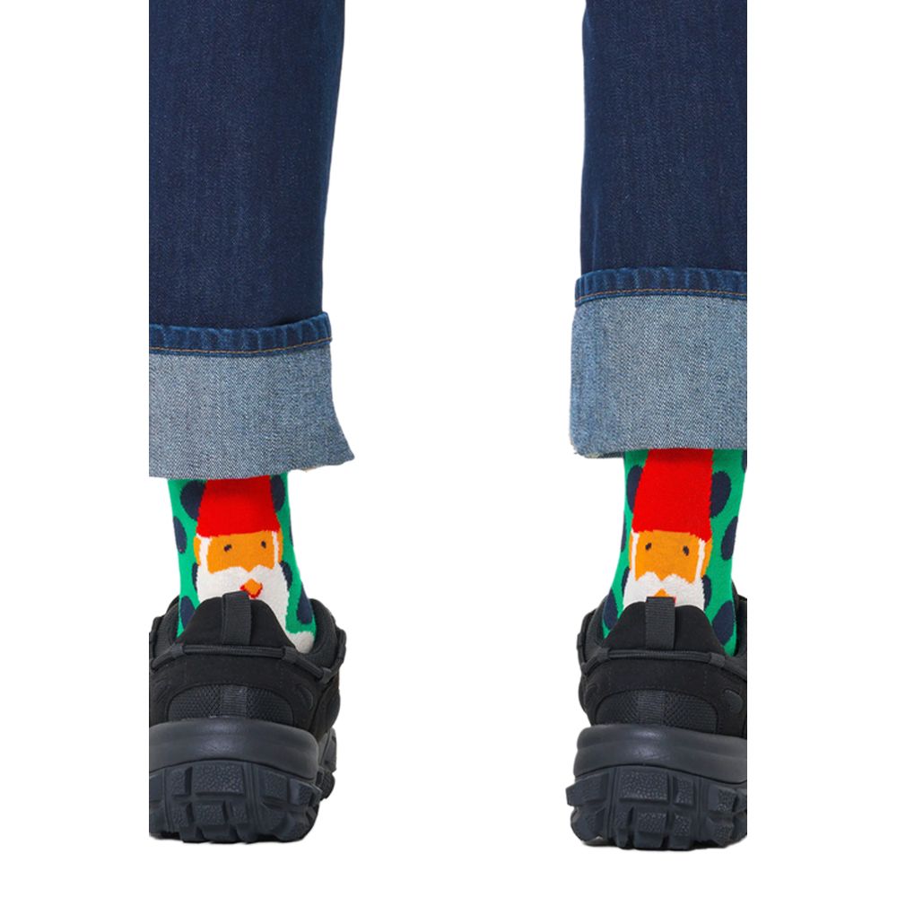 Back view of Happy Socks Green Cotton Socks with Santa design worn with jeans and shoes.