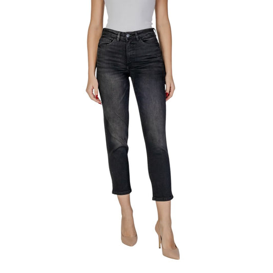 Woman wearing ICHI Black Cotton Mom Jeans with high waist and straight leg, showcasing modern style and comfort.
