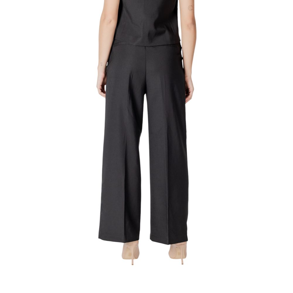 Model wearing ICHI Black Polyester Pant with sophisticated palazzo style and elegant wide-cut design.