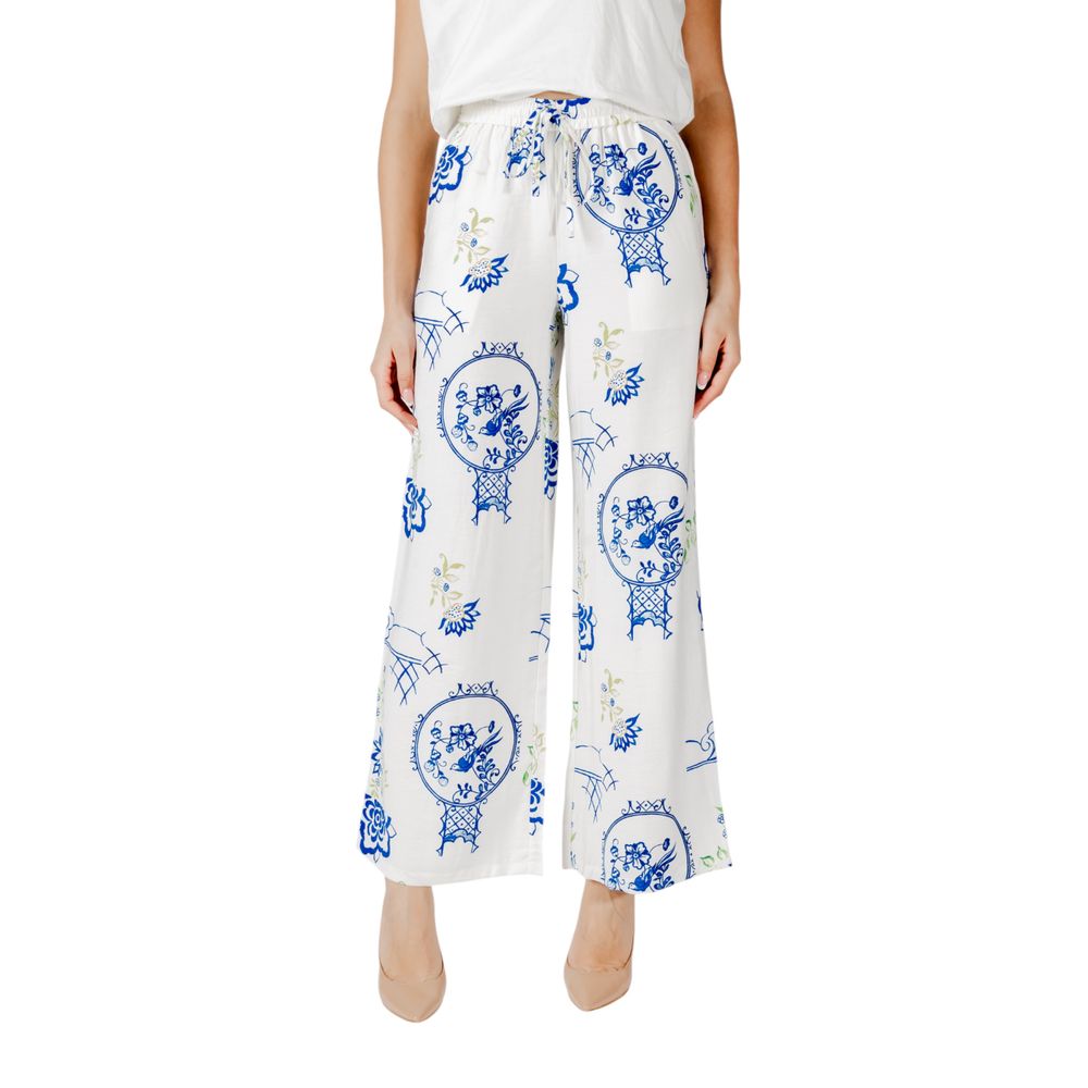 Woman wearing ICHI White Viscose Pant with blue floral print, showcasing wide-leg design for casual chic style.