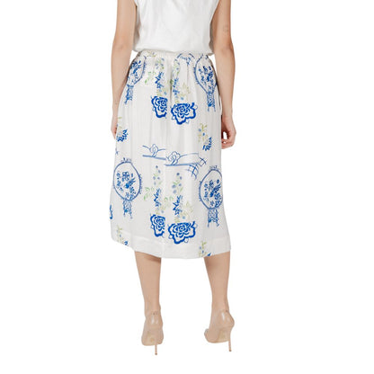Back view of ICHI White Viscose Skirt featuring blue floral design on a woman