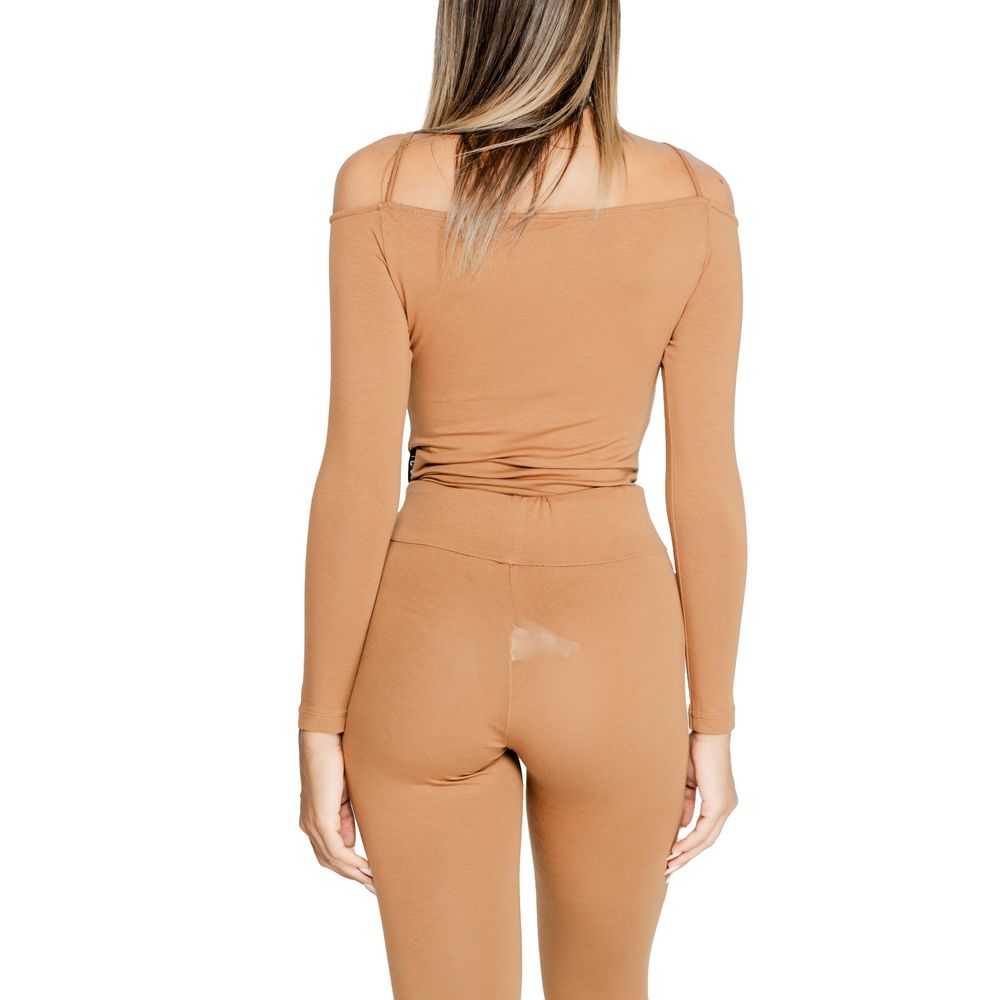 Woman wearing Icon Brown Cotton Bodysuit made of 90% cotton and 10% polyester, showcasing modern design and versatility.