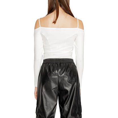 Back view of Icon White Cotton Bodysuit with modern design, paired with black pants