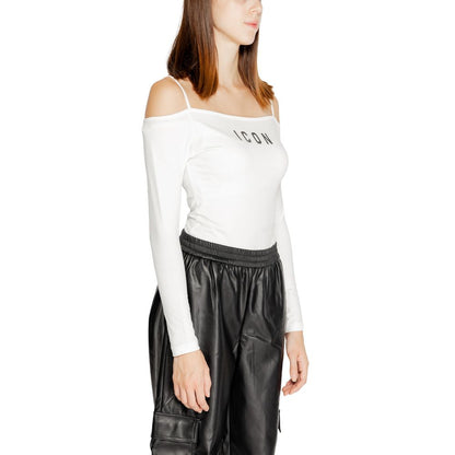 Woman wearing Icon White Cotton Bodysuit with black pants, side view.